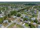 Wide aerial view showcasing a residential neighborhood with mature trees and well-maintained streets at 5583 Miles Dr, Port Orange, FL 32127