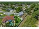 A view from above highlighting an in-ground pool surrounded by palm trees at 5583 Miles Dr, Port Orange, FL 32127