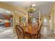 Dining room with table and view to kitchen, living room, and front entry at 5583 Miles Dr, Port Orange, FL 32127
