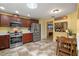 Kitchen with stainless steel appliances, granite counters, and pass-through to the living room at 5583 Miles Dr, Port Orange, FL 32127