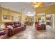 Open-concept living area with stylish tile flooring and comfortable seating at 5583 Miles Dr, Port Orange, FL 32127