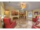 Comfortable living room with a stone fireplace and stylish tile flooring at 5583 Miles Dr, Port Orange, FL 32127