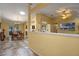 Open-concept living space with tile flooring, skylight and view of the dining area at 5583 Miles Dr, Port Orange, FL 32127