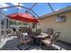 Covered patio featuring comfortable seating around a fire pit table, offering an outdoor living space at 5583 Miles Dr, Port Orange, FL 32127