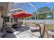 Outdoor patio area with seating, string lights and grill, perfect for backyard entertaining at 5583 Miles Dr, Port Orange, FL 32127