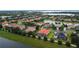 An elevated view capturing the community's layout, showcasing well-kept homes and waterfront properties at 5615 Oxford Moor Blvd, Windermere, FL 34786