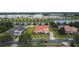 Spacious single-Gathering home with terracotta roof on a large lot by a lake at 5615 Oxford Moor Blvd, Windermere, FL 34786
