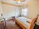 Cozy bedroom boasts hardwood floors, a ceiling fan, a window with blinds, and a closet at 5615 Oxford Moor Blvd, Windermere, FL 34786