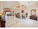 Bright and spacious dining room featuring tile flooring, elegant columns, and a chandelier at 5615 Oxford Moor Blvd, Windermere, FL 34786