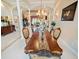 An inviting dining room features a chandelier, decor, and an open view into the living room at 5615 Oxford Moor Blvd, Windermere, FL 34786