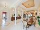 A dining room sits adjacent to the living room with neutral paint and decor at 5615 Oxford Moor Blvd, Windermere, FL 34786