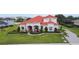 Beautiful two-story home featuring a terracotta roof, fountain, and manicured landscaping at 5615 Oxford Moor Blvd, Windermere, FL 34786