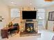 Modern fireplace with custom stone work, with views of pool just outside the windows at 5615 Oxford Moor Blvd, Windermere, FL 34786