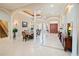 Inviting foyer showcases tile flooring, a stairway, and a glimpse into the adjacent dining room at 5615 Oxford Moor Blvd, Windermere, FL 34786