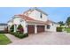 Spacious house featuring a two-car garage and manicured landscaping at 5615 Oxford Moor Blvd, Windermere, FL 34786