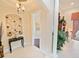 Hallway boasts tile flooring, a decorative niche, and a view into other rooms at 5615 Oxford Moor Blvd, Windermere, FL 34786