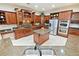 Beautiful kitchen with custom cabinets, stainless steel appliances, and granite countertops at 5615 Oxford Moor Blvd, Windermere, FL 34786