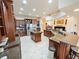 Open kitchen with granite counters, stainless appliances, and central island for food prep at 5615 Oxford Moor Blvd, Windermere, FL 34786