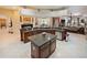 Spacious kitchen featuring a large island, stainless steel appliances, and granite countertops at 5615 Oxford Moor Blvd, Windermere, FL 34786