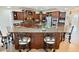 Inviting kitchen featuring granite countertops, custom cabinets, and seating at the bar at 5615 Oxford Moor Blvd, Windermere, FL 34786