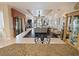 Spacious living room with stone fireplace, tile floors, and sliding glass doors to outdoor area at 5615 Oxford Moor Blvd, Windermere, FL 34786