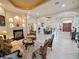 Spacious living room with fireplace, recessed lighting, tiled floor and elegant furnishings, creating a welcoming space at 5615 Oxford Moor Blvd, Windermere, FL 34786