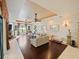 Spacious living room with stone fireplace and sliding glass doors that lead to an outdoor area at 5615 Oxford Moor Blvd, Windermere, FL 34786