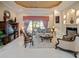 Elegant living room featuring tile flooring, ornate furnishings, and a view of the outdoor pool area at 5615 Oxford Moor Blvd, Windermere, FL 34786