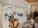 Open-concept living room with high ceilings, arched entryways, tile floors, and elegant furnishings, creating a spacious atmosphere at 5615 Oxford Moor Blvd, Windermere, FL 34786