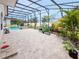 Spacious patio with brick flooring, leading to a pool and garden area at 5615 Oxford Moor Blvd, Windermere, FL 34786