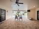 Covered patio area with brick flooring, chairs, and a view of the pool at 5615 Oxford Moor Blvd, Windermere, FL 34786