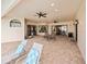 Expansive patio with lounge chairs and ample space for outdoor entertaining, enhanced with ceiling fans at 5615 Oxford Moor Blvd, Windermere, FL 34786