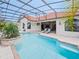 Outdoor swimming pool with brick trim in screened in enclosure at 5615 Oxford Moor Blvd, Windermere, FL 34786