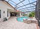 Beautiful pool and spa area with a screened enclosure, complemented by a well-maintained patio at 5615 Oxford Moor Blvd, Windermere, FL 34786