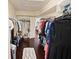 Well-organized walk-in closet with hanging rods and shelves offers ample storage space and convenience at 5615 Oxford Moor Blvd, Windermere, FL 34786