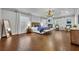 Spacious main bedroom with hardwood floors, a fireplace, and plenty of natural light at 605 W Palm Valley Dr, Oviedo, FL 32765