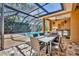 Outdoor dining area featuring built in kitchen overlooking the pool at 605 W Palm Valley Dr, Oviedo, FL 32765
