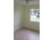 Bright bedroom featuring tile floors, natural light from the window, and a ceiling fan at 7028 Clarcona Ocoee Rd., Orlando, FL 32818