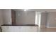 Bright living space showcasing a breakfast bar with pendant lighting and an open floor plan at 7028 Clarcona Ocoee Rd., Orlando, FL 32818