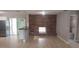 Open-concept living space with brick fireplace and sliding doors to the outdoor area at 7028 Clarcona Ocoee Rd., Orlando, FL 32818