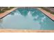 A serene in-ground swimming pool with refreshing blue water at 7028 Clarcona Ocoee Rd., Orlando, FL 32818