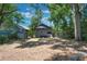 Backyard featuring shed and mature trees creating shade, offering a serene outdoor space at 735 N Clara Ave, Deland, FL 32720