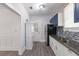 Modern kitchen features stainless steel appliances, white cabinets, and granite countertops at 735 N Clara Ave, Deland, FL 32720