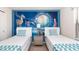 Themed bedroom featuring twin beds and fairytale wall art at 8924 Bengal Ct, Kissimmee, FL 34747