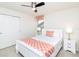 Well-lit bedroom with a queen bed, two nightstands, and a window with stylish valance at 8924 Bengal Ct, Kissimmee, FL 34747