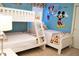 Bright bedroom features bunk beds, a twin bed, fun geometric decor, and plenty of natural light at 8924 Bengal Ct, Kissimmee, FL 34747