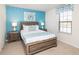 Comfortable bedroom featuring a full-size bed, two nightstands, and a window with stylish valance at 8924 Bengal Ct, Kissimmee, FL 34747