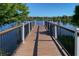 Beautiful lakefront walking dock with views of the water and surrounding community homes at 8924 Bengal Ct, Kissimmee, FL 34747