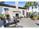 Outdoor fireplace lounge area with comfortable seating at 8924 Bengal Ct, Kissimmee, FL 34747