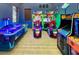 Community game room filled with various modern arcade games for fun entertainment at 8924 Bengal Ct, Kissimmee, FL 34747